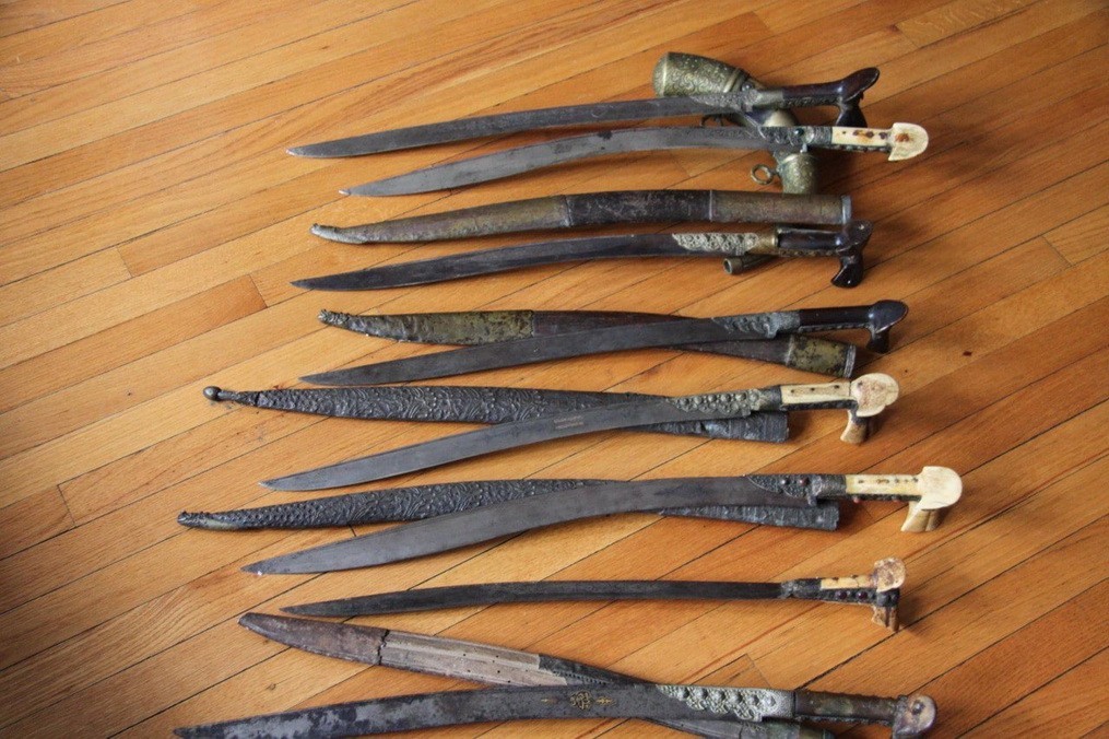 antique sword with horsemen with scimitars etched on the blade